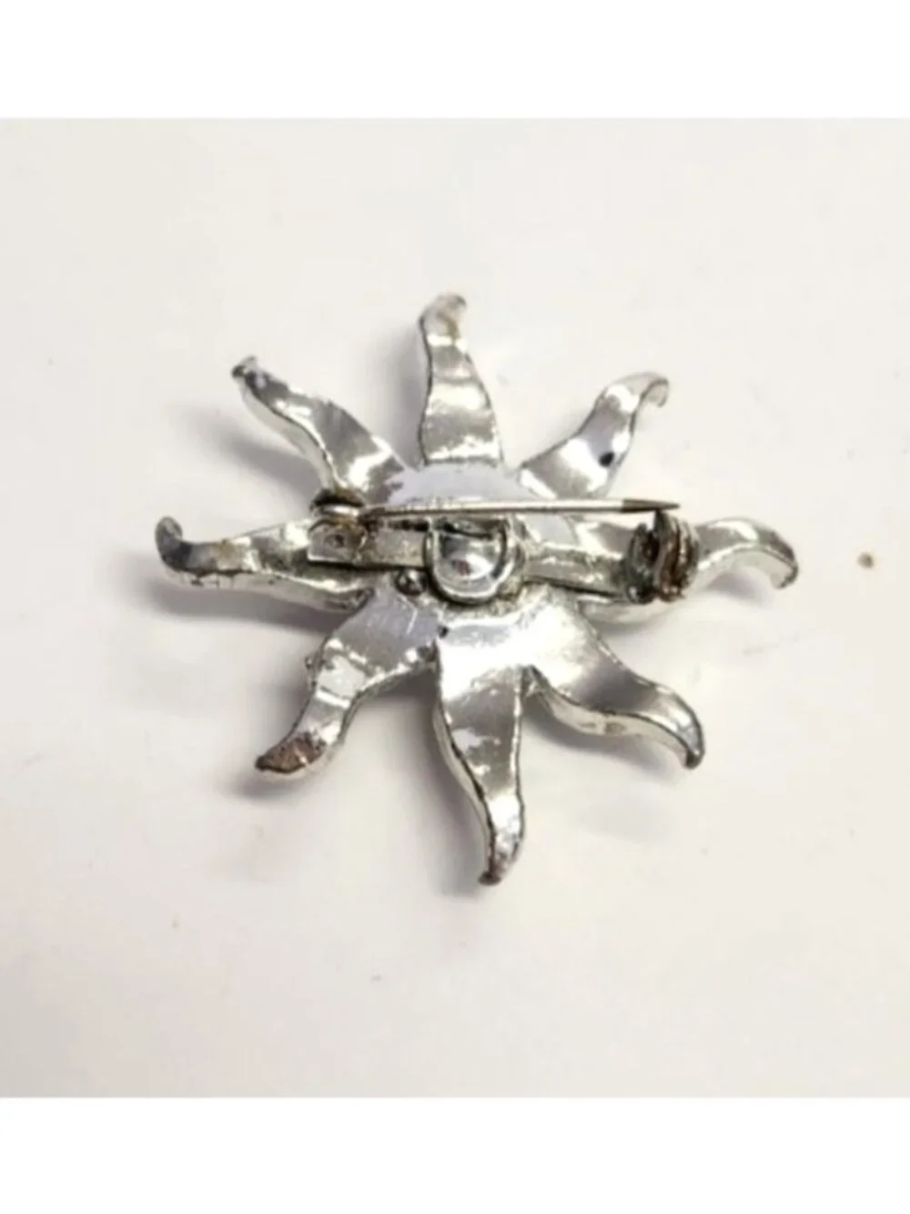 Rhinestone Sunburst Brooch With Silver-Tone Metal